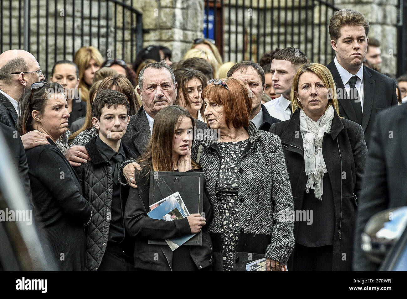 Mourners outside St Mary the Virgin Church, Barry, Wales, after the funeral service of 17-year-old Corey Price, one of three teenagers killed in a car crash near Brecon earlier this month, arrives at St Mary the Virgin Church, Barry, Wales. Stock Photo
