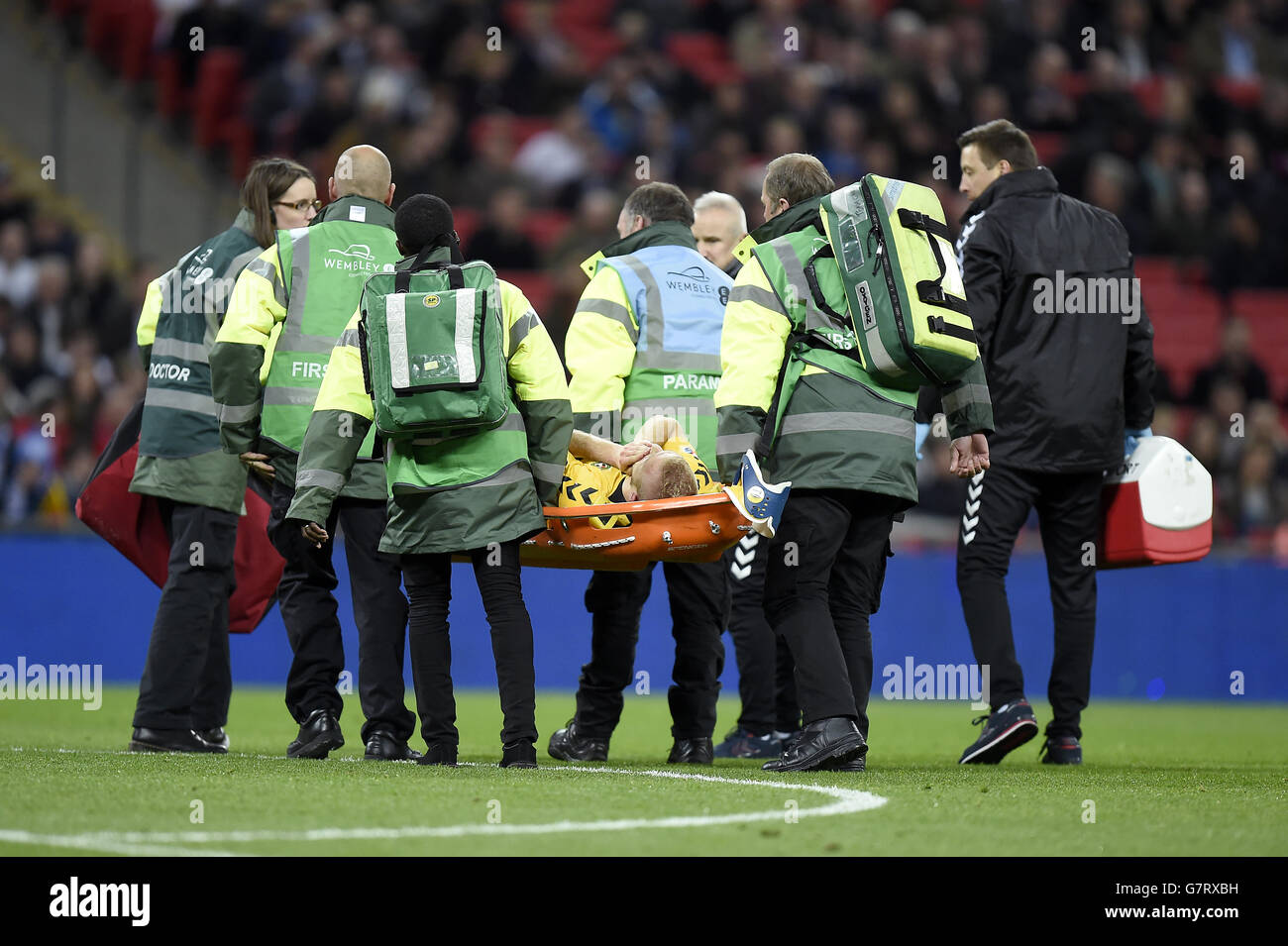 Lithuania's Vytautas Andriuskevicius gets taken off on a stretcher during the UEFA 2016 Qualifying, Group E match at Wembley Stadium, London. Stock Photo