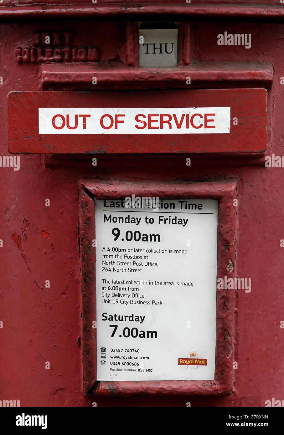 General view of a Royal mail Postbox with a sign saying 'Out of Service' in the letter slot Stock Photo