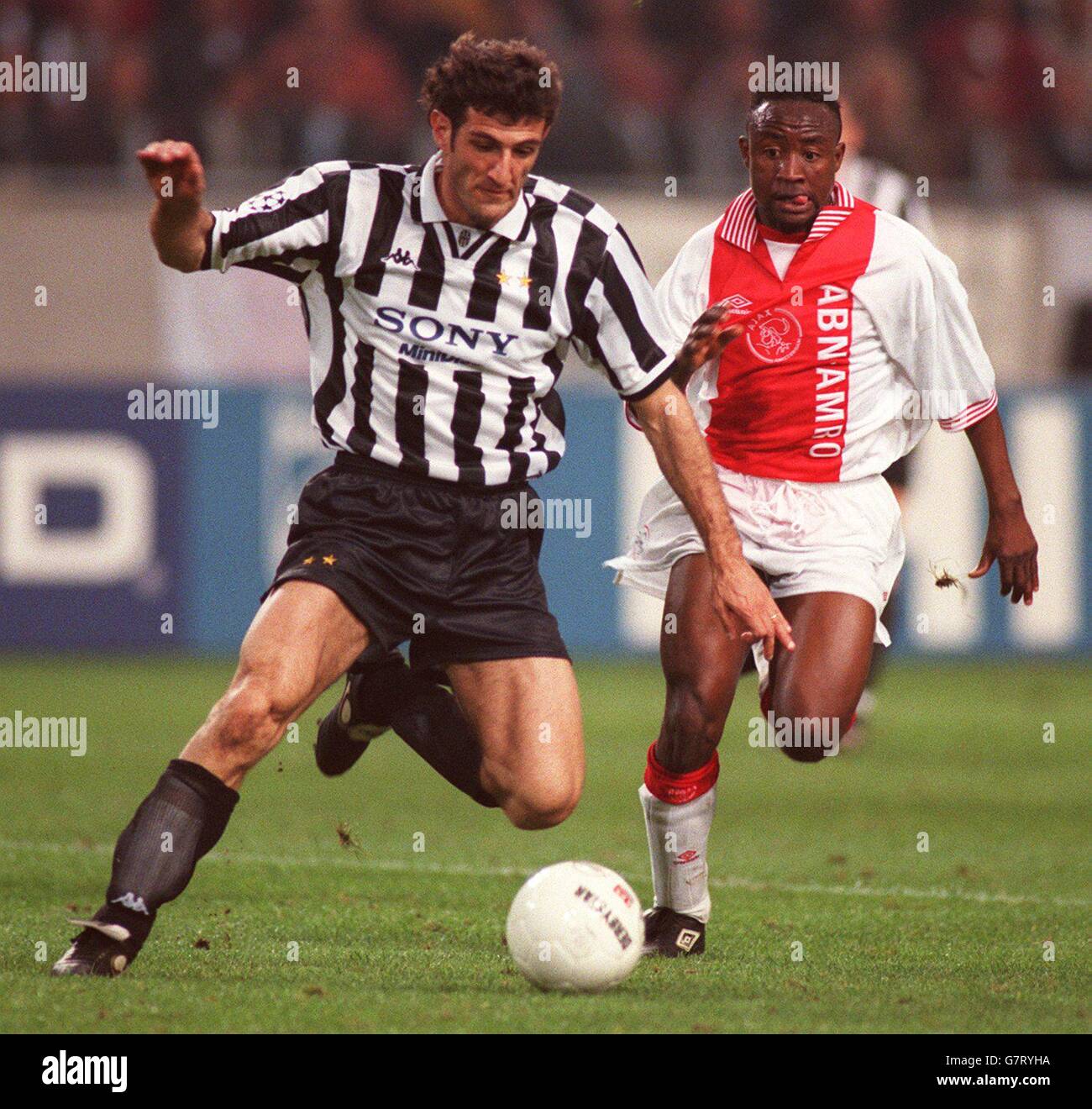 Soccer ... UEFA Champions League ... Ajax v Juventus. Ciro Ferrara, Juventus is put under pressure by Tijani Babangida Stock Photo