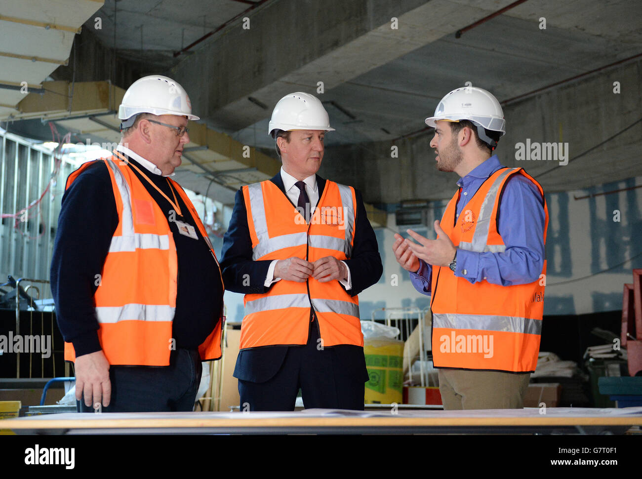 Conservative party leader David Cameron (centre) views the new digital hub, under construction at the Sainsbury's head office in Holborn London, during the 2015 election campaign. Stock Photo