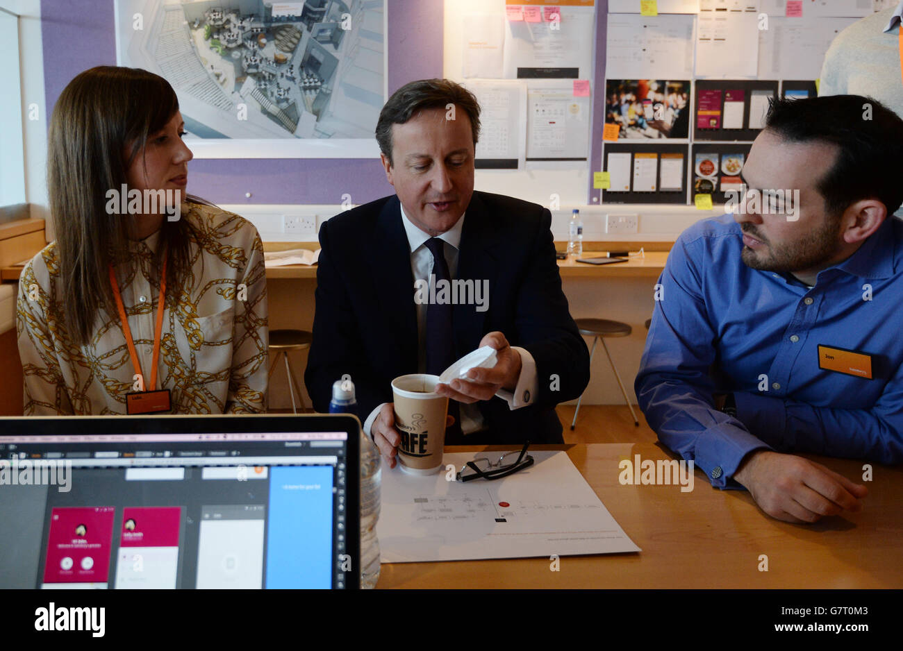 Conservative party leader David Cameron (centre) meets digital staff at the Sainsbury's head office in Holborn London, where he saw how they design their interactive website. Stock Photo