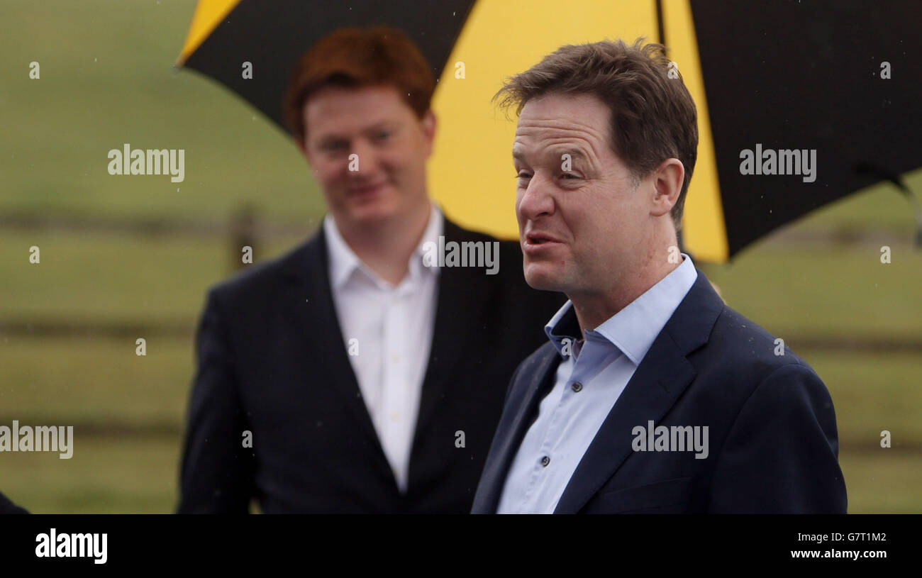 Liberal Democrat leader Nick Clegg (right) and Chief Secretary of the Treasury Danny Alexander during the unveiling of a Liberal Democrat election poster in Hyde, Cheshire. Stock Photo