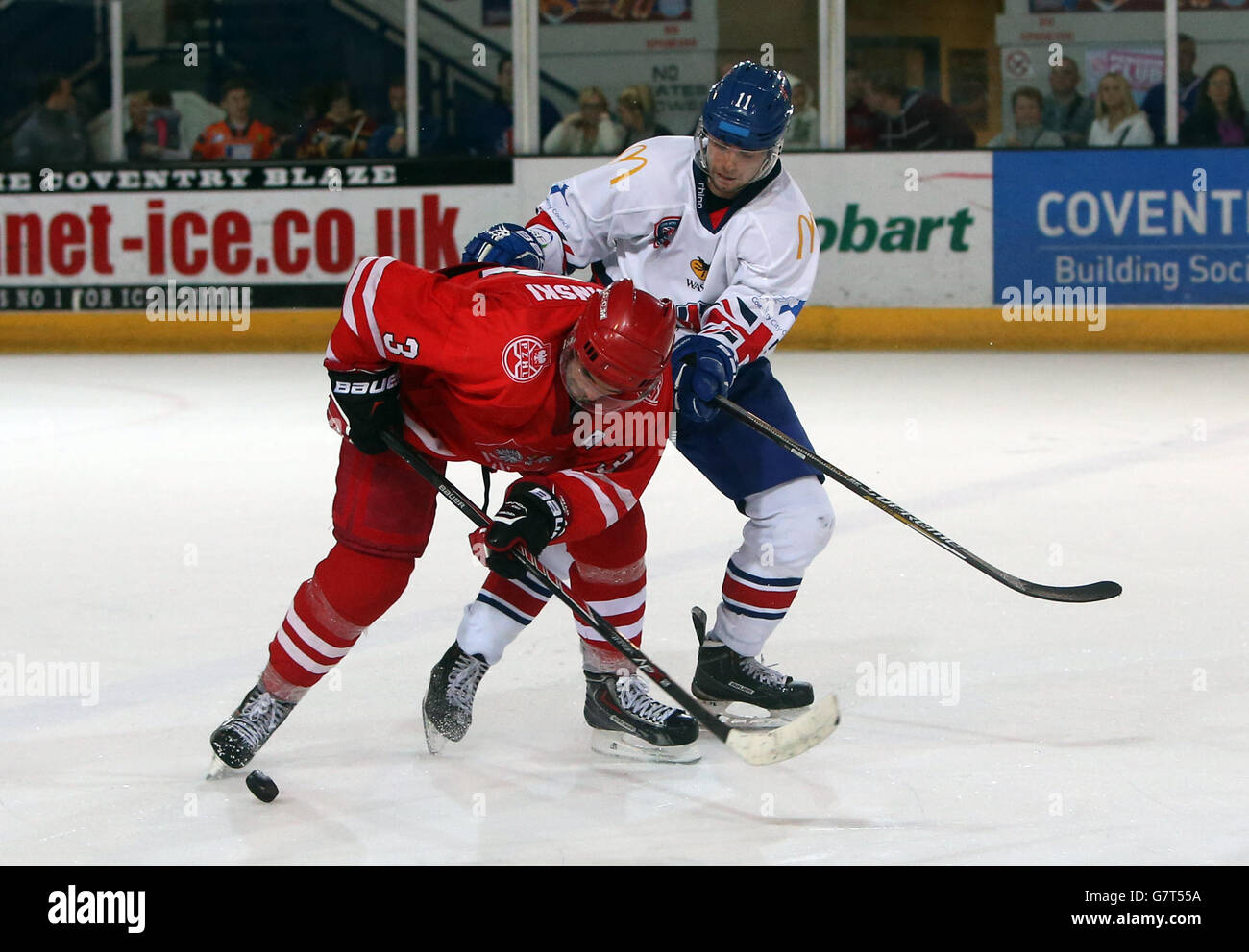 Great Britain's Mark Garside and Poland's Adam Baginski (right) battle for the puck Stock Photo