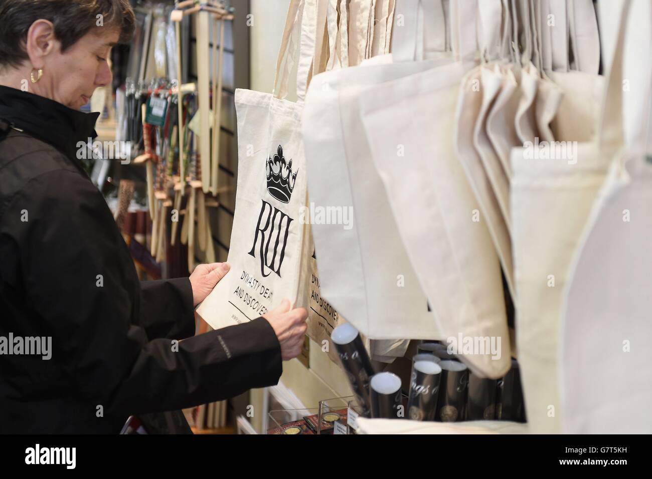 A woman looks at a souvenir bag in the gift shop at the Richard III