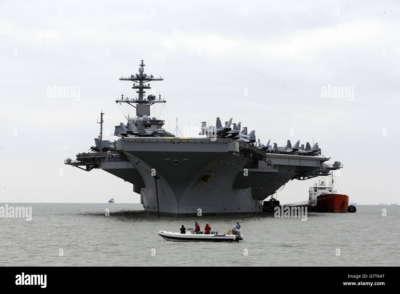 The US aircraft carrier USS Theodore Roosevelt, currently at anchor off the UK's south coast as it is too big to enter one of the Royal Navy's major bases, the carrier, one of ten Nimitz class aircraft carriers in the US fleet, arrived at Portsmouth, Hampshire, yesterday for a five-day visit. Stock Photo