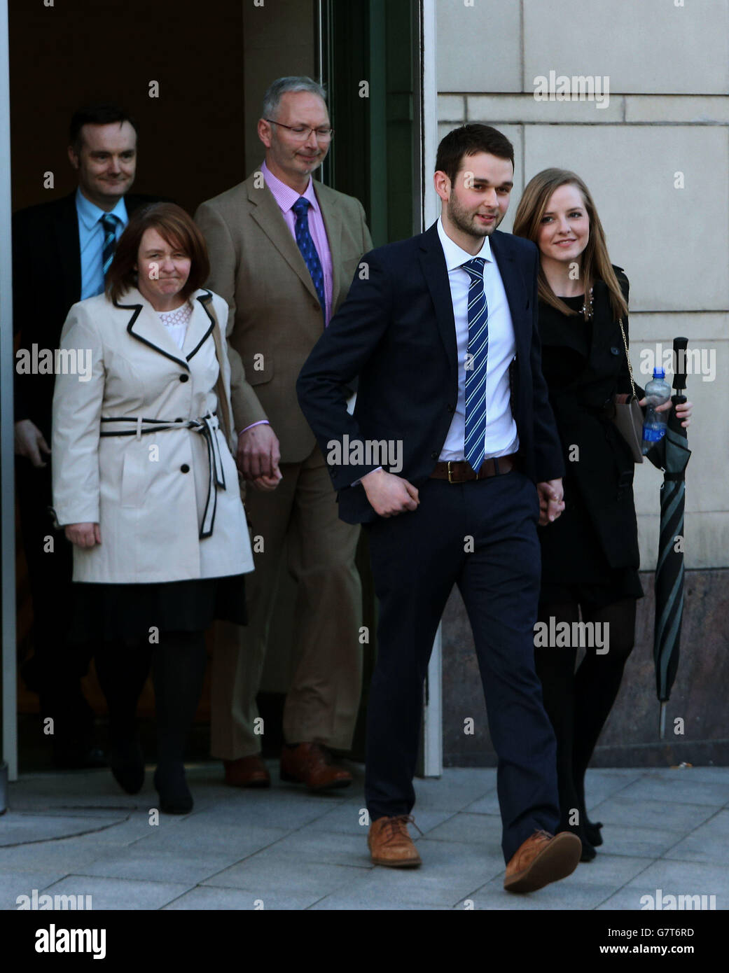 Daniel and Amy McArthur followed by founders of Ashers bakery and Mr. McArthur's parents, Colin (third left) and Karen McArthur, leave Belfast County Court, where Northern Ireland's Equality Commission is supporting a legal action against family-run Christian bakery, Ashers Bakery, on behalf of gay rights activist Gareth Lee, whose order of a cake with an image of Sesame Street puppets Bert and Ernie below the motto 'Support Gay Marriage' was declined. Stock Photo
