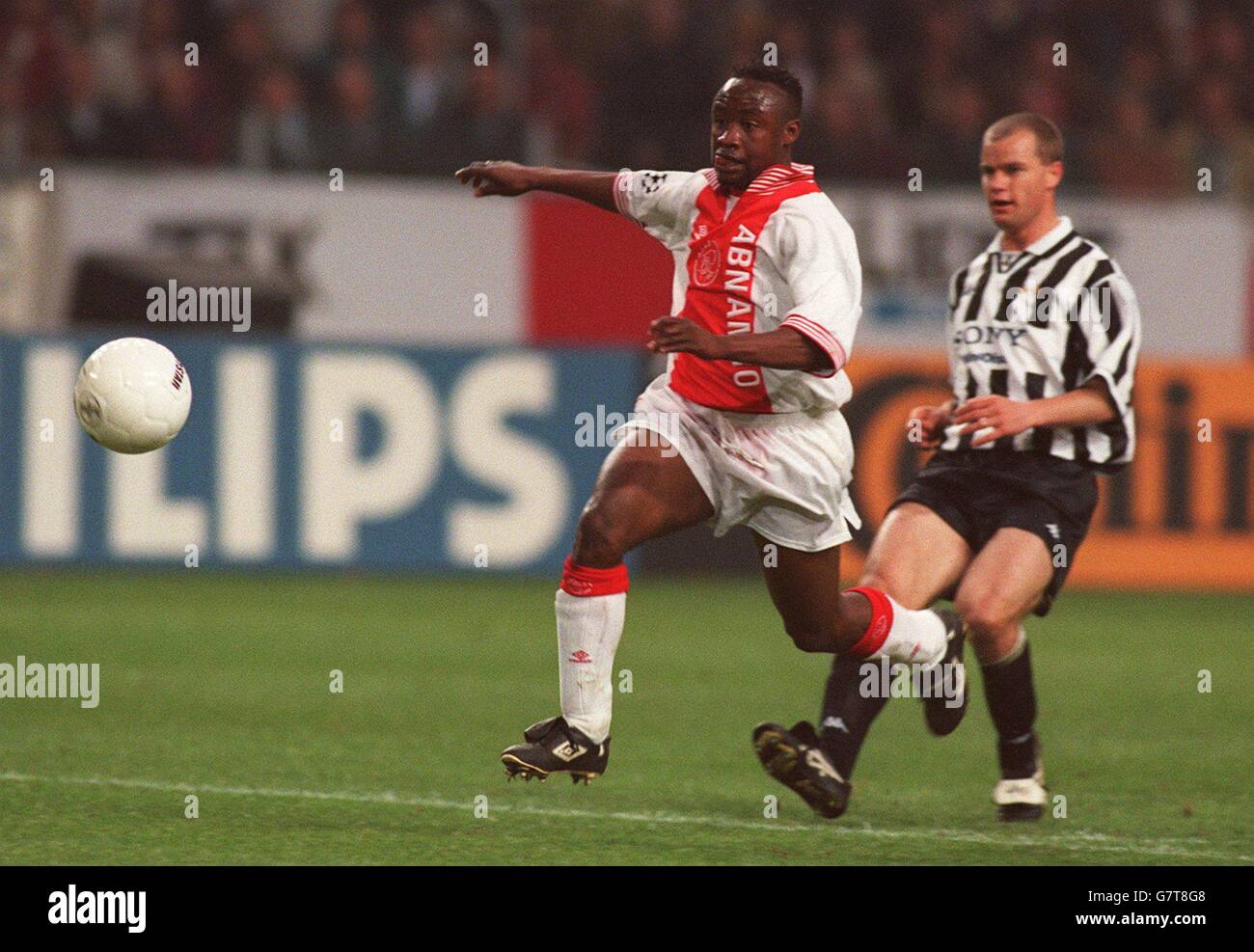 Tijani Babangida, Ajax chase for the ball with Gianluca Pessotto, Juventus Stock Photo