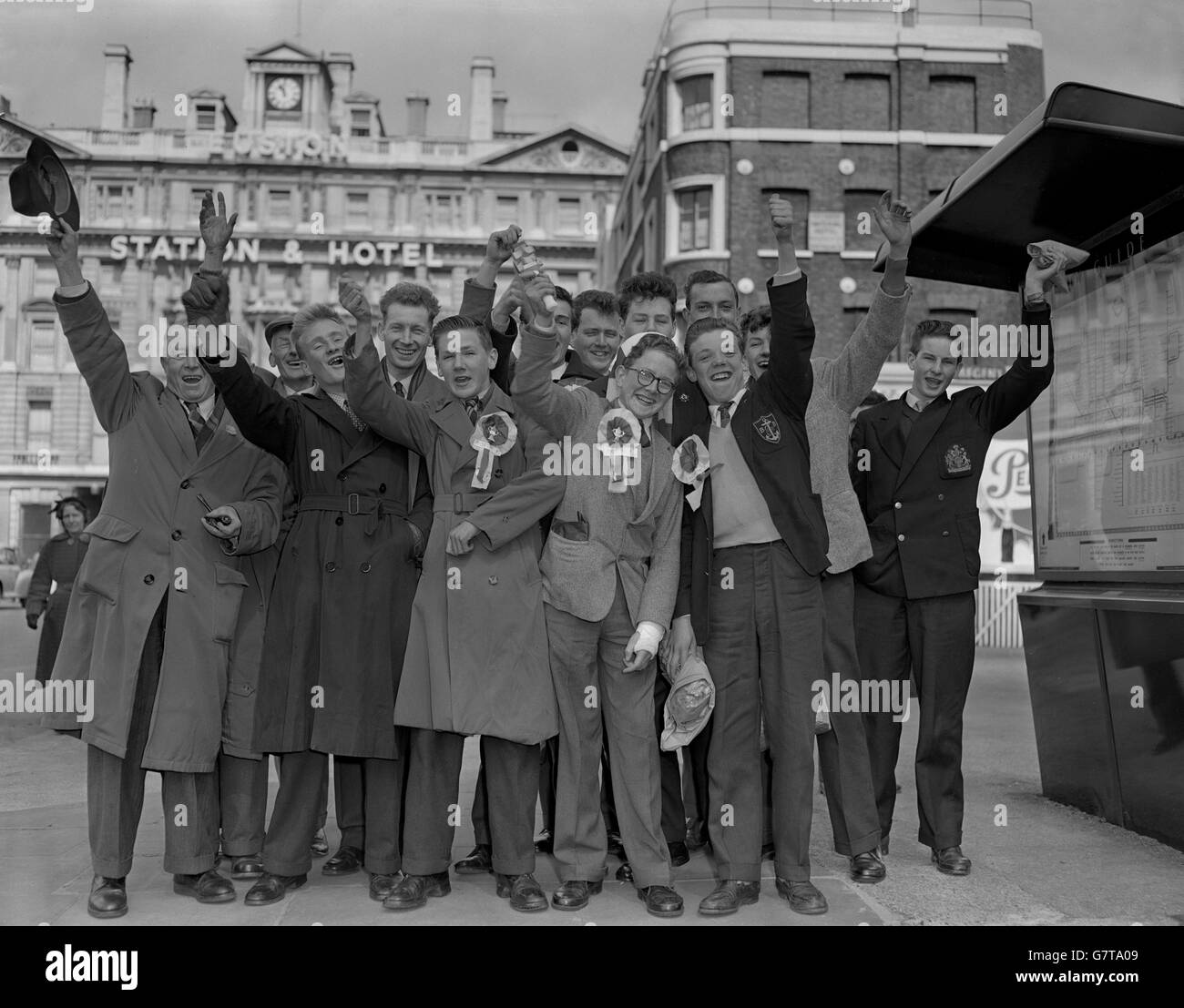 Nottingham Forest supporters raise a cheer at Euston Station after their arrival in London to see their team play against Luton Town in the FA Cup final at Wembley. Stock Photo
