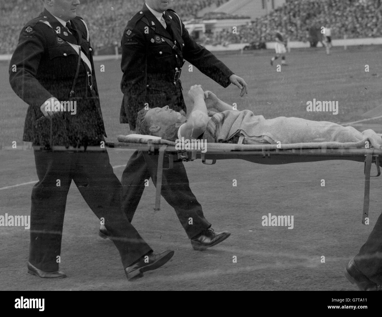 Nottingham Forest outside right Roy Dwight, who scored his team's first goal, is carried off the furled on a stretcher after a collision with another player during the FA Cup final at Wembley. He was taken to hospital with a suspected broken leg. Stock Photo
