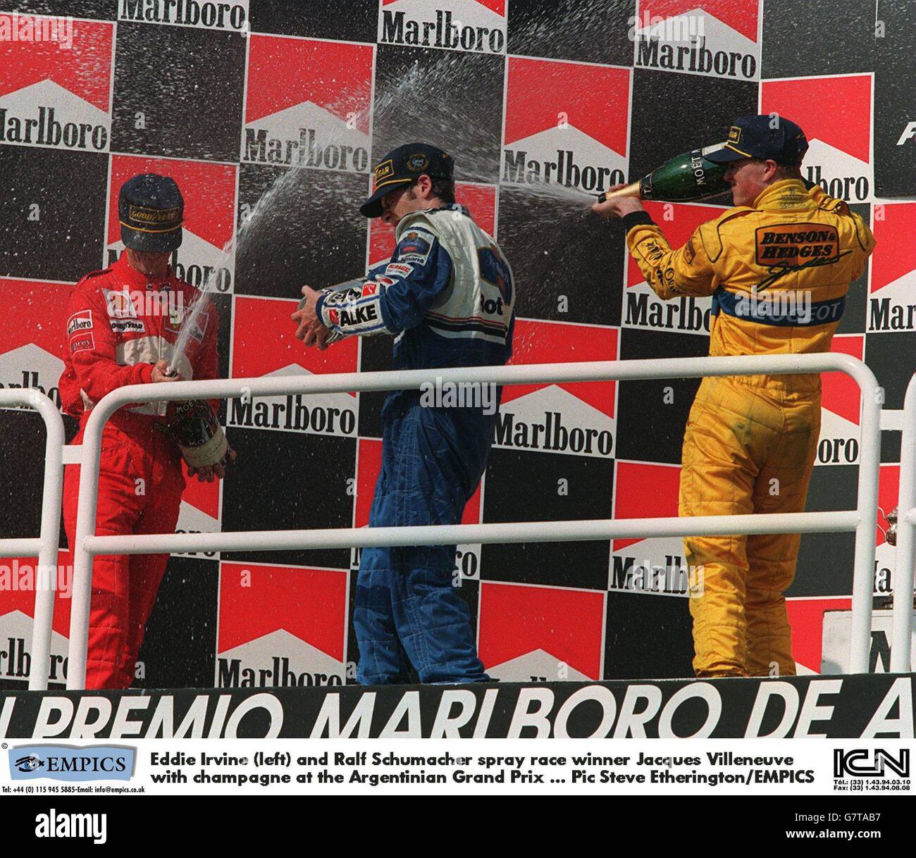 Eddie Irvine (left) and Ralf Schumacher spray race winner Jacques