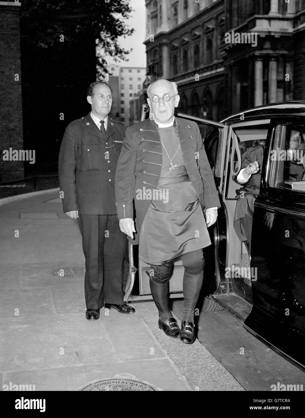 Dr. Geoffrey Fisher, the Archbishop of Canterbury, pictured as he arrives at 10 Downing Street, when 21 Archbishops and Metropolitans of the Anglican Communion who are attending the Lambeth Conference, had dinner with the Prime Minister. They were 'paired' with 21 distinguished laymen. Stock Photo