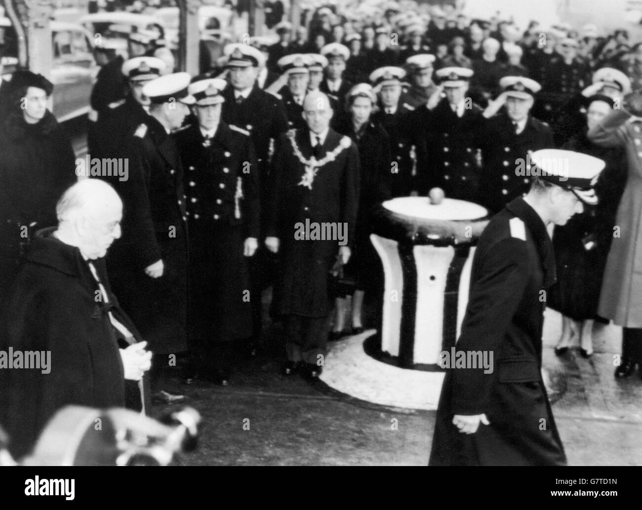 Dressed in the uniform of an Admiral of the Fleet, the Duke of Edinburgh goes on board the Royal Navy vessel, HMS Wakeful, at Portsmouth dockyard, followed by the Archbishop of Canterbury, Dr. Geoffrey Fisher. They were going on board to attend the funeral of Countess Mountbatten which, at her request, was carried out at sea off Portsmouth. Stock Photo