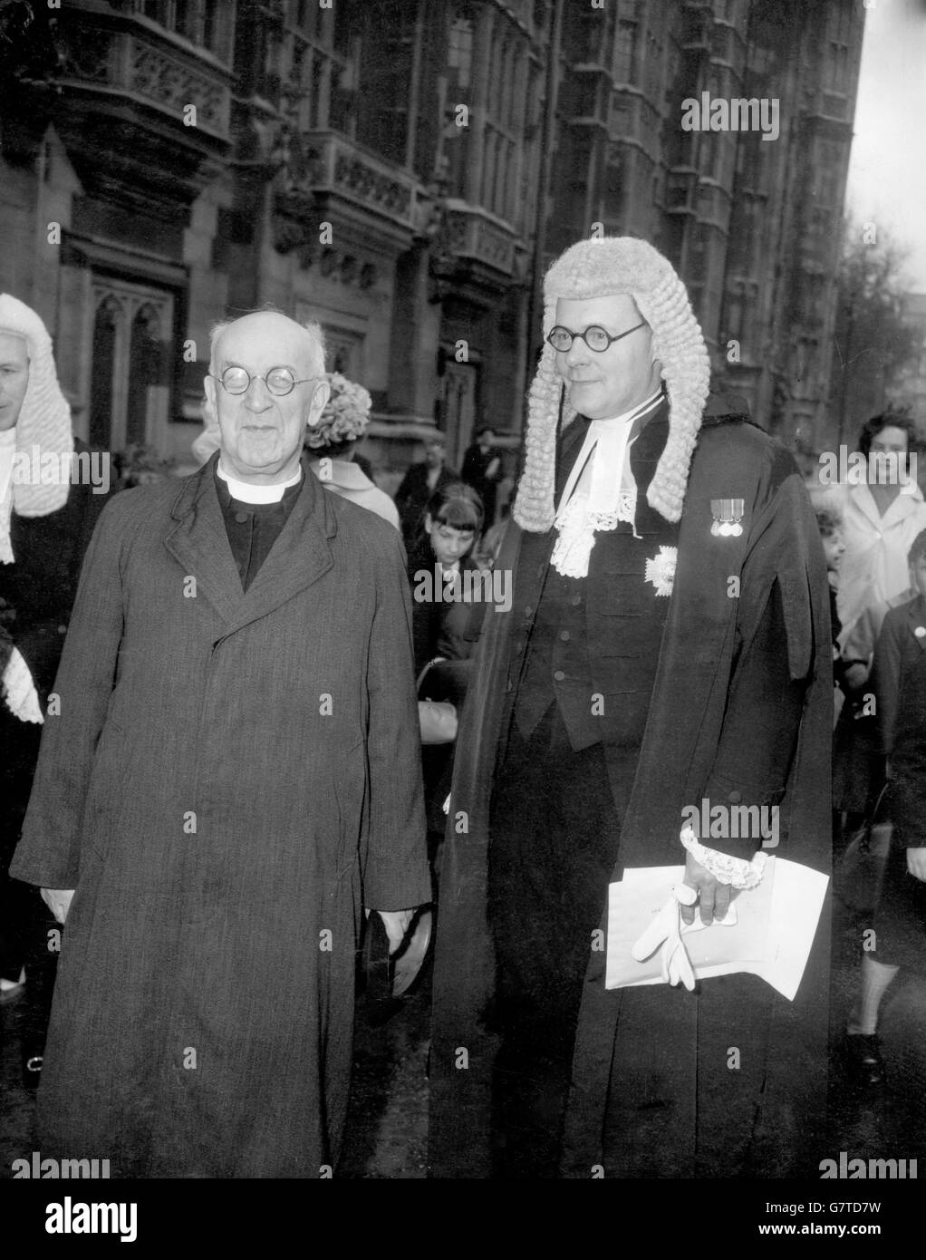 Dr, Geoffrey Fisher, Archbishop of Canterbury, arrives at Westminster for the swearing in ceremony at the House of Lord's. Also pictured is Sir George Coldstream (r). Stock Photo