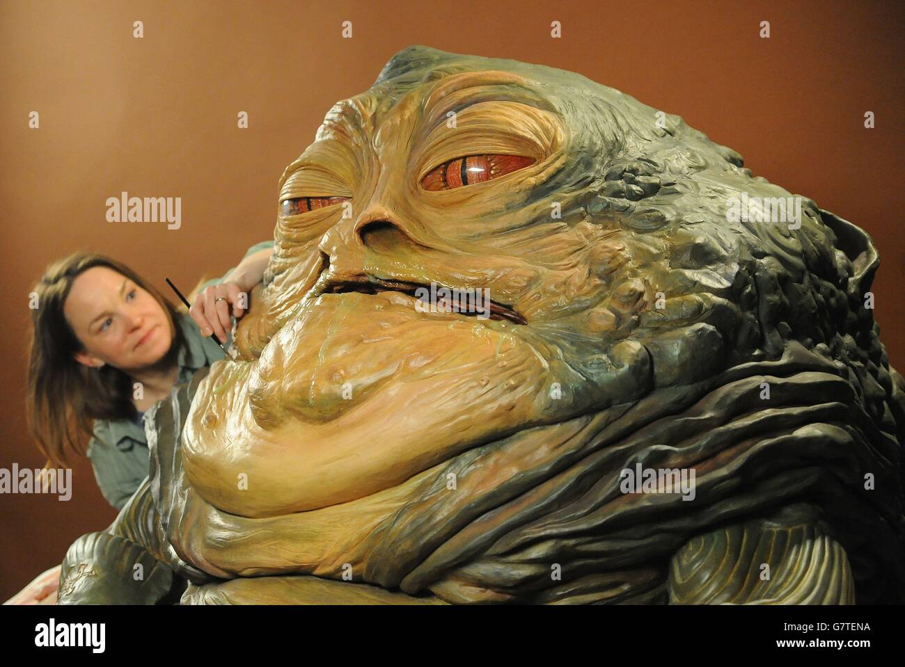 Amanda Tremewen applies the finishing touches to a wax figure of Jabba the Hutt which along with Princess Leia, is part of Madame Tussauds' new Star Wars Experience attraction which opens to the public on Saturday May 16. Stock Photo