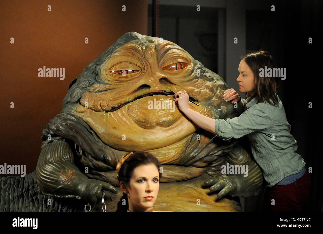 Amanda Tremewen applies the finishing touches to a wax figure of Jabba the Hutt which along with Princess Leia, is part of Madame Tussauds' new Star Wars Experience attraction which opens to the public on Saturday May 16. Stock Photo