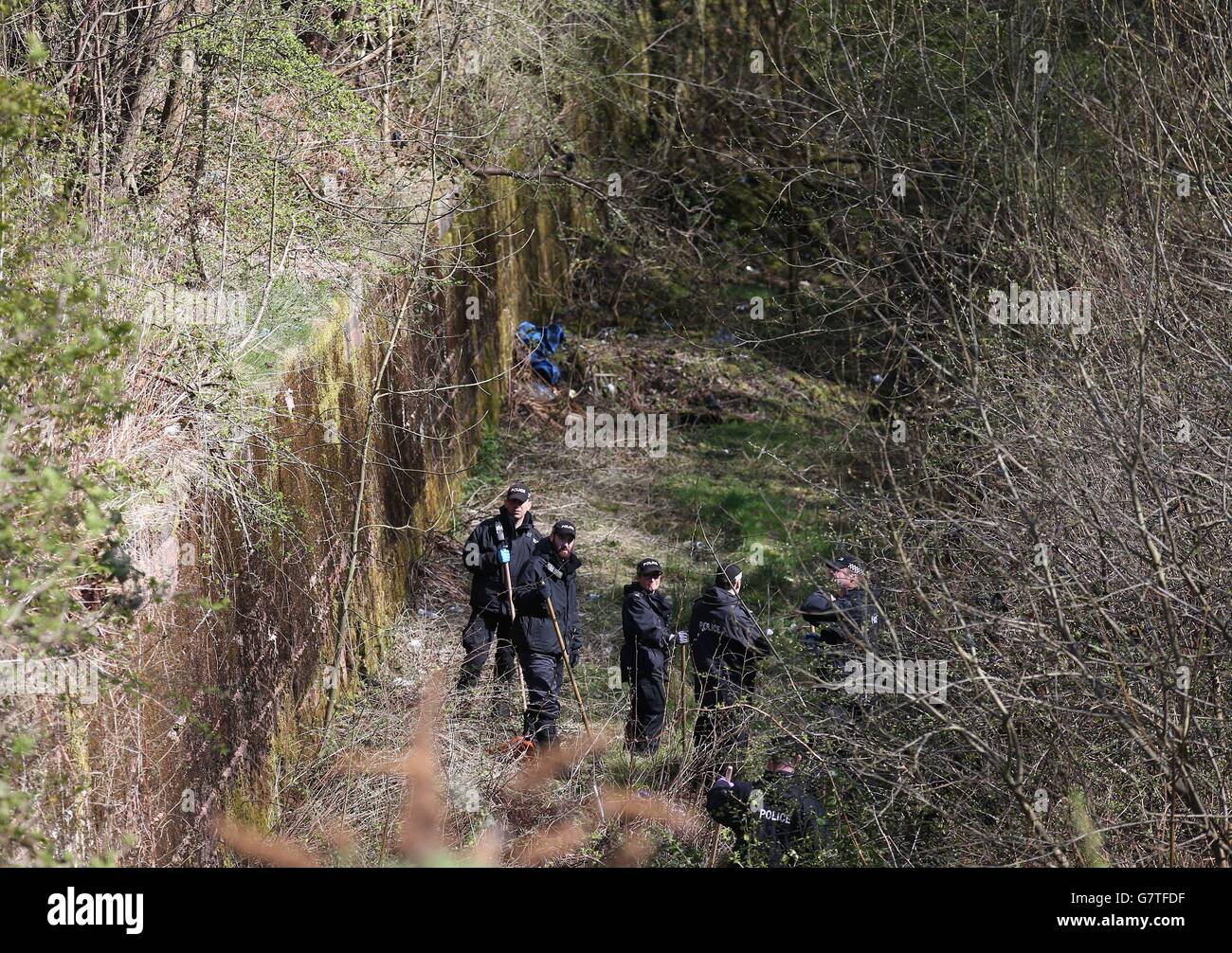 Police search garages and the surrounding areas near a block of flats in Dorchester Avenue in Glasgow for any trace of Irish student Karen Buckley who has been missing for three days. Stock Photo