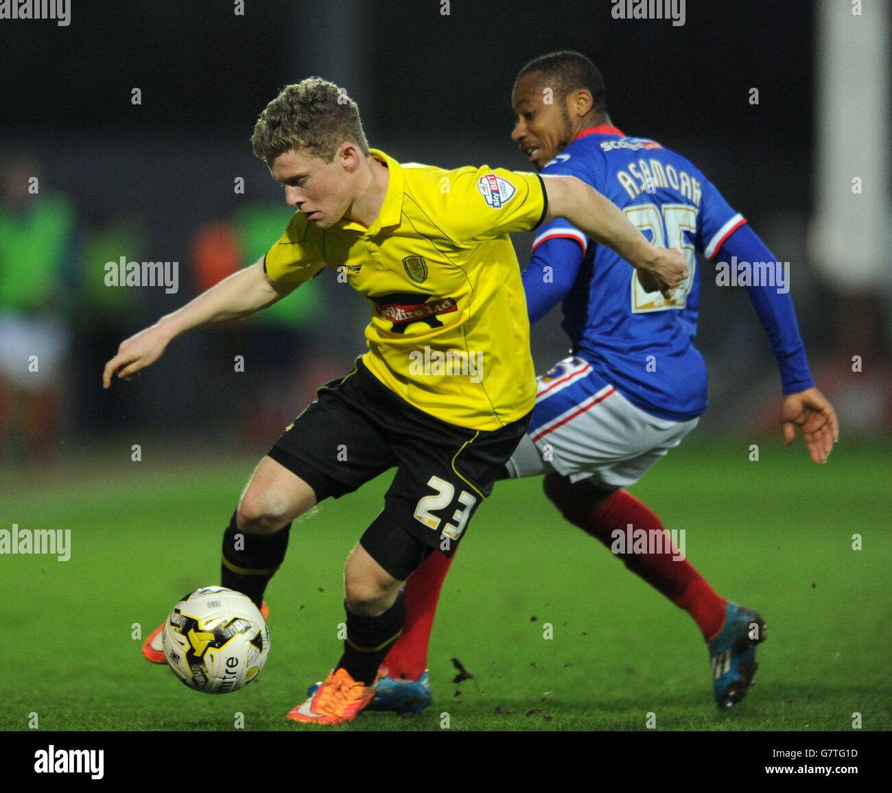 Burton Albion's Stephen Ward (left) and Carlisle's Derek Asamoah battle