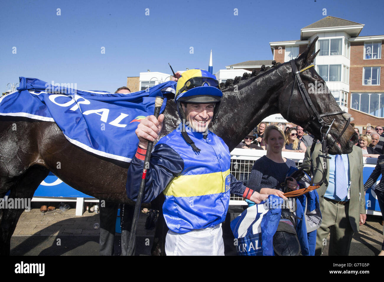 Robert Dunne celebrates after winning the Coral Scottish Grand National Handicap Chase on Wayward Prince during the 2015 Coral Scottish Grand National Festival at Ayr Racecourse. Stock Photo