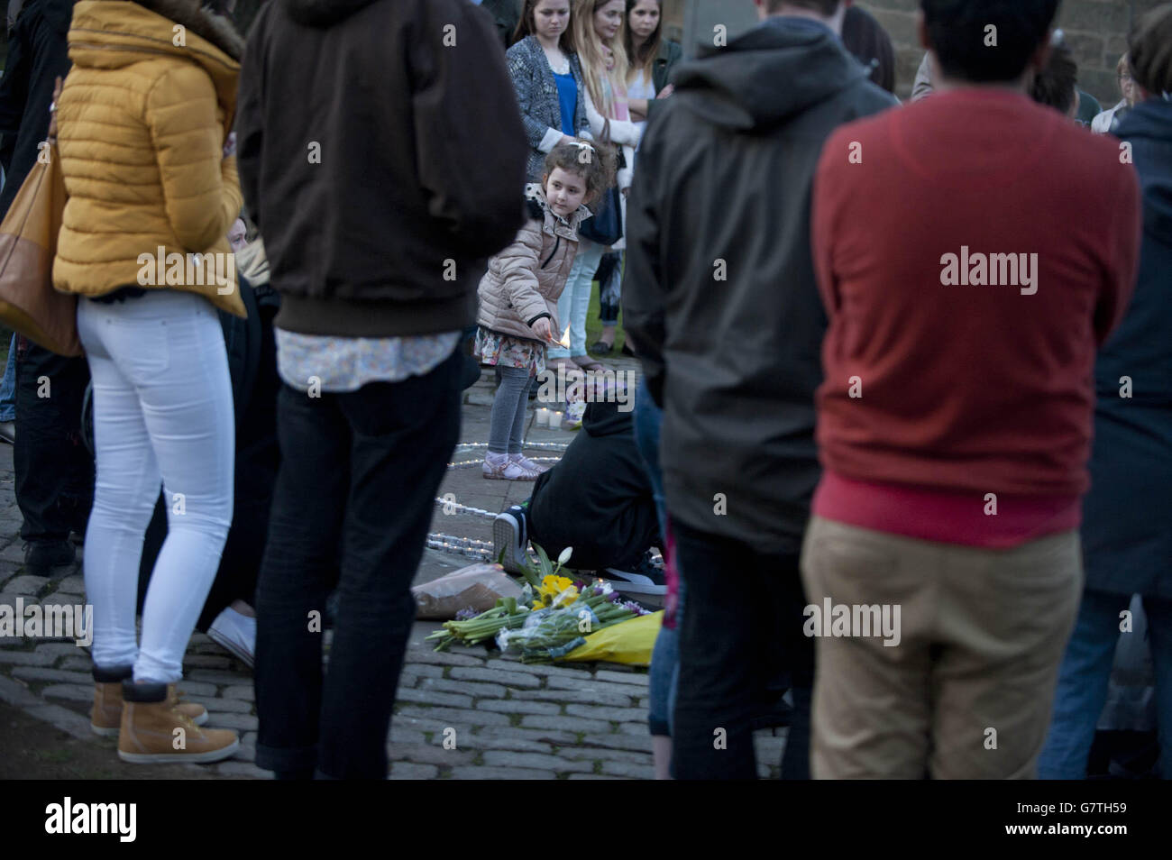 People attend a silent vigil for Irish student Karen Buckley,24, in a park off Hill Street where Miss Buckley was living, after her body was found at High Craigton Farm on the north-western outskirts of the city following a four-day search. Stock Photo