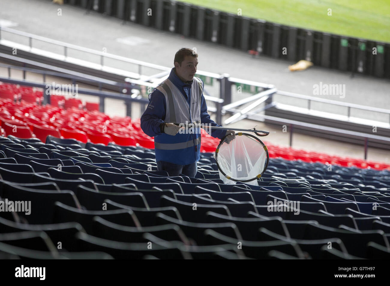 Ground staff clean the stands before the William Hill Scottish Cup Semi Final match at Hampden Park, Glasgow. PRESS ASSOCIATION Photo. Picture date: Sunday April 19, 2015. See PA story SOCCER Inverness. Photo credit should read: Jeff Holmes/PA Wire. Stock Photo