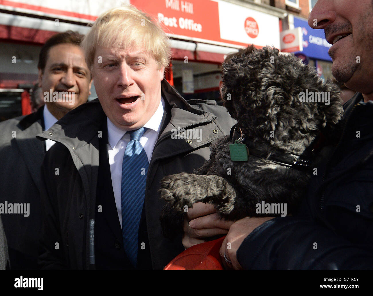 Mayor of London Boris Johnson after being licked by a dog as he meets members of the public and local business owners after launching the Conservative London campaign at Hartley Hall in Mill Hill, London. Stock Photo