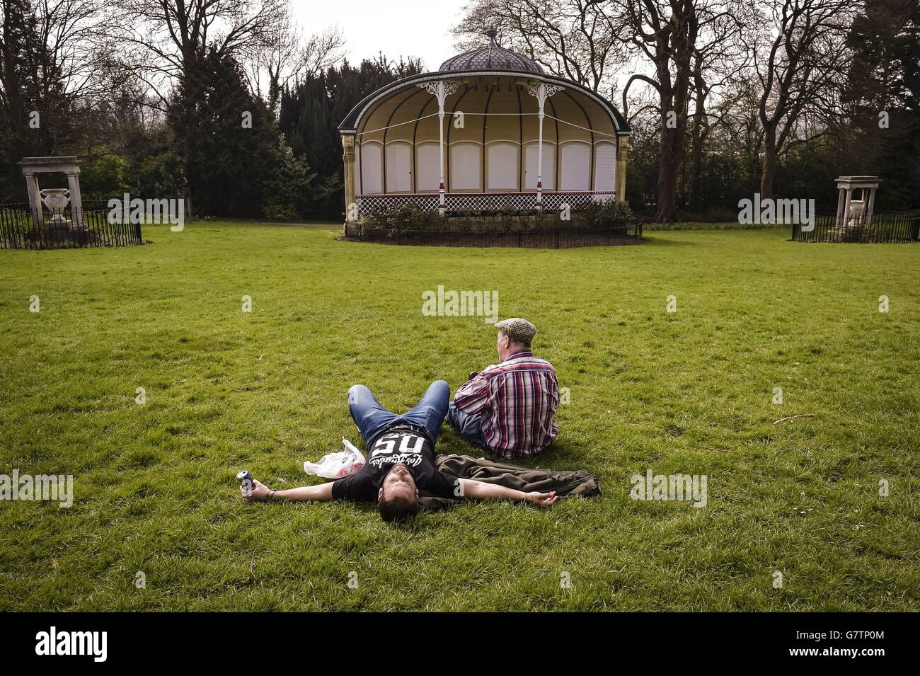 People relax at Royal Victoria Park, Bath as the warm weather continues across the UK. Stock Photo