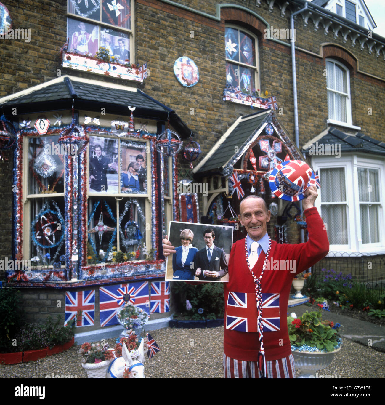 Exactly a month before the Royal wedding and Fred English, 85, patriotic from hat to shows, has his Manor Road house in East Molesey, Surrey, decorated for the Royal wedding. Stock Photo