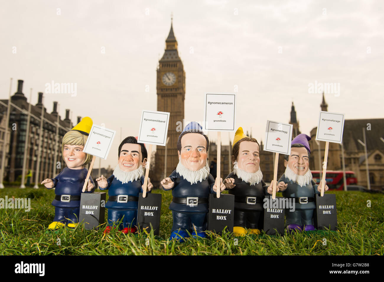 Garden gnome depictions of the UK political party leaders (left to right) Scottish National Party leader Nicola Sturgeon, Labour leader Ed Miliband, Conservative Party leader and Prime Minister David Cameron, Liberal Democrats leader Nick Clegg and Ukip leader Nigel Farage, which have been created by DIY chain B&Q, in front of the Houses of Parliament, in Westminster, London. Stock Photo