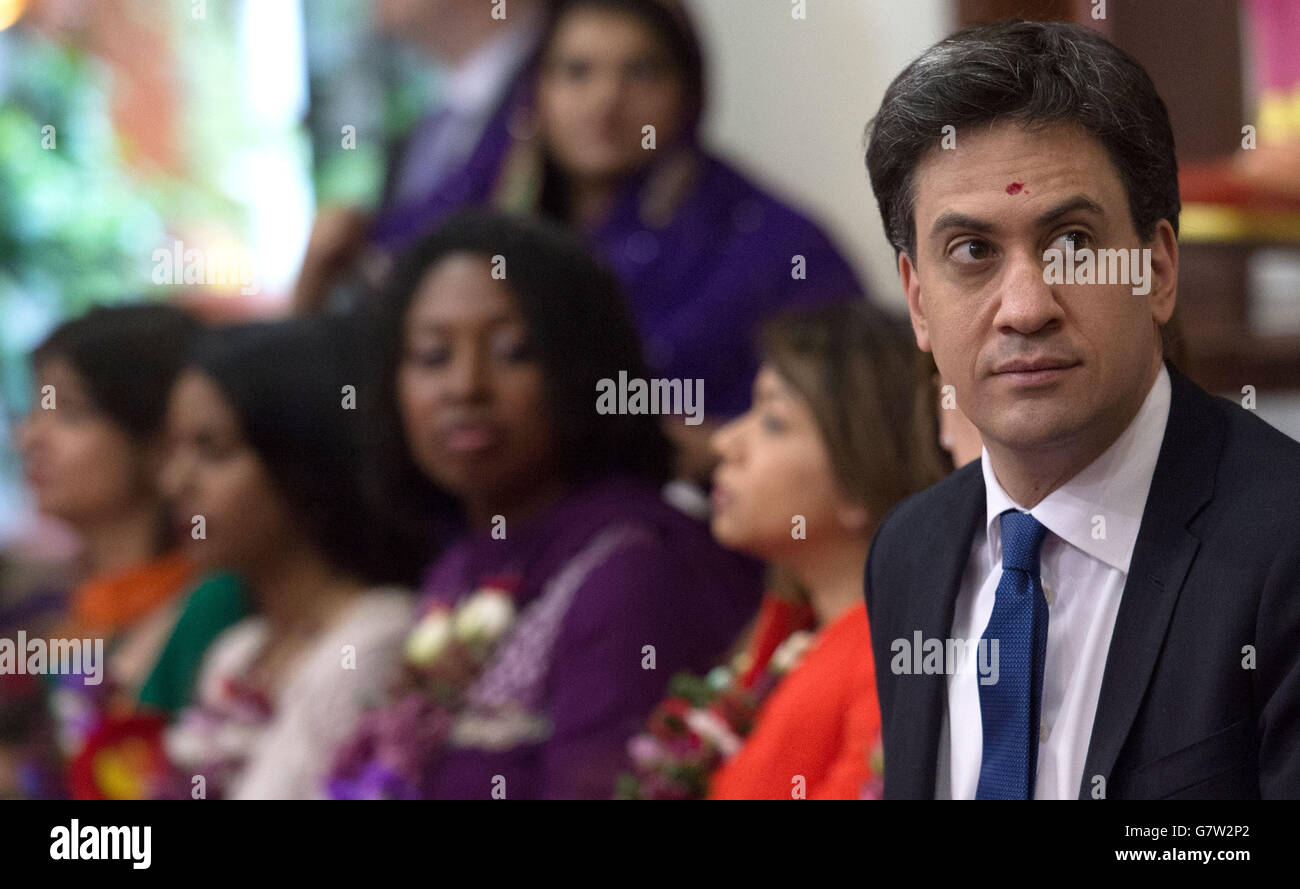 Labour leader Ed Miliband and his wife Justine meet Hindu devotees at the Shree Swaminarayan Temple in Willesden Green, London, where they attended a celebration ceremony. Stock Photo