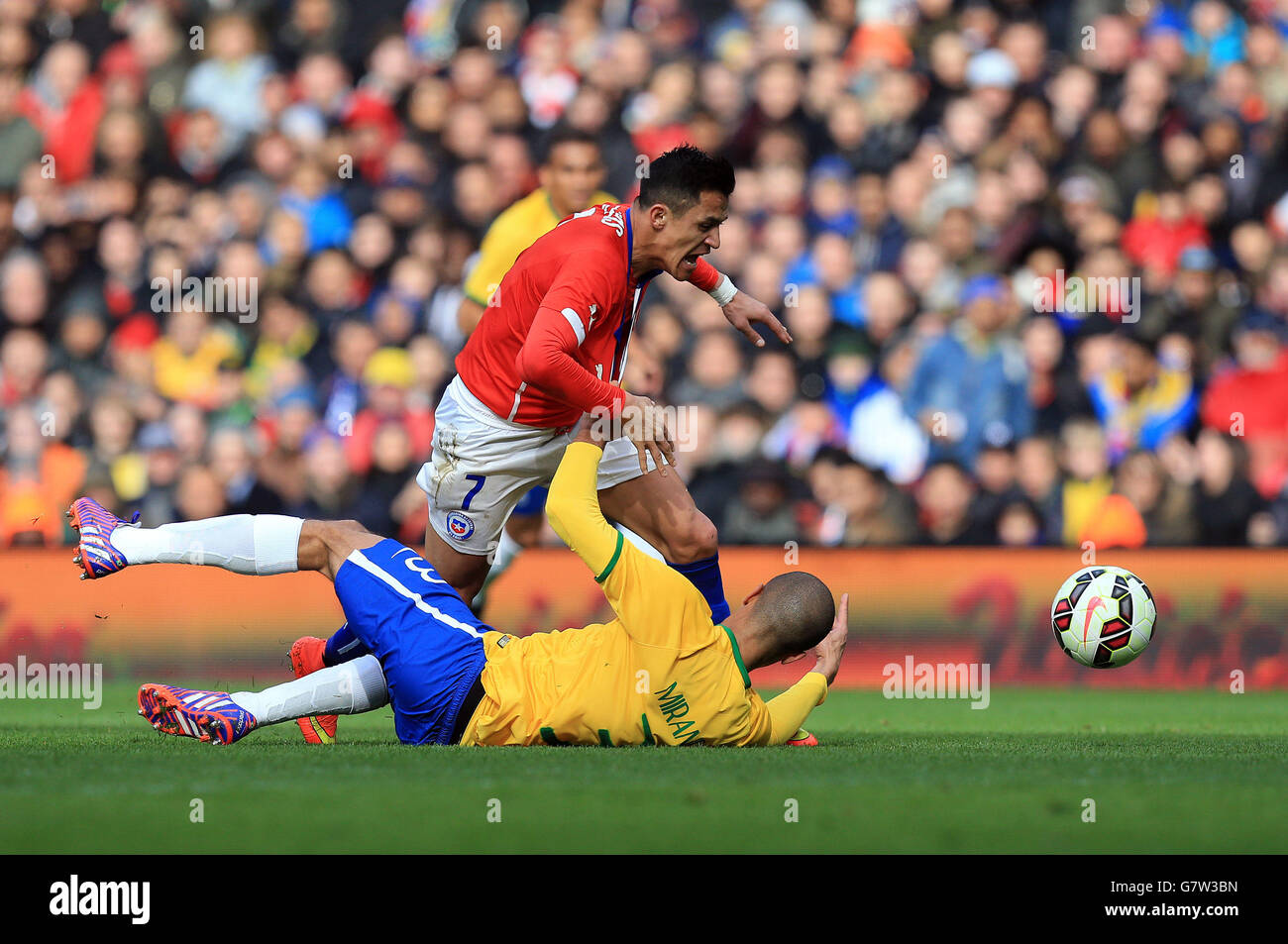 Chile's Alexis Sanchez is brought down by Brazil's Miranda during the International Friendly at the Emirates Stadium, London. Stock Photo