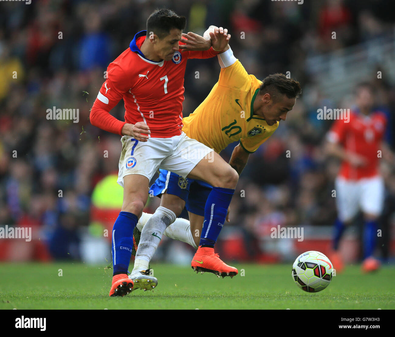 Brazil's Neymar (right) and Chile's Alexis Sanchez battle for the ball. Stock Photo