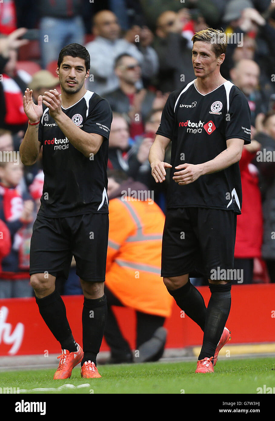 Luis Suarez (left) and Fernando Torres after the Liverpool All Stars Charity match at Anfield, Liverpool. Stock Photo