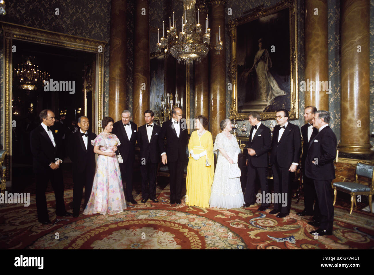 The Queen and members of the Royal Family in the Blue Drawing Room at Buckingham Palace, as they entertained seven world leaders in London for the Downing Street Summit talks. (l-r) Pierre Trudeau (Canada), Takeo Fukuda (Japan), Princess Margaret, James Callaghan, Prince Charles, Giscard d'Estaing (France), Queen Elizabeth II, the Queen Mother, President Carter (USA), Giulio Andreotti (Italy), Prince Philip and Helmut Schmidt (West Germany.) Stock Photo