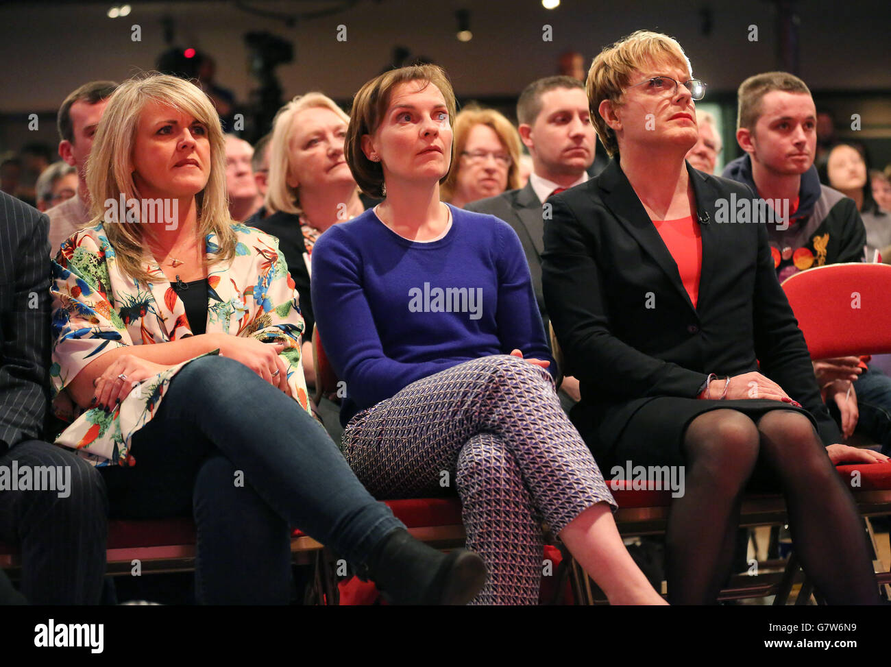 (Left - right) Sally Lindsay, Justine Miliband and Eddie Izzard listen to Labour leader Ed Miliband addressing supporters at Parr Hall, Warrington. Stock Photo