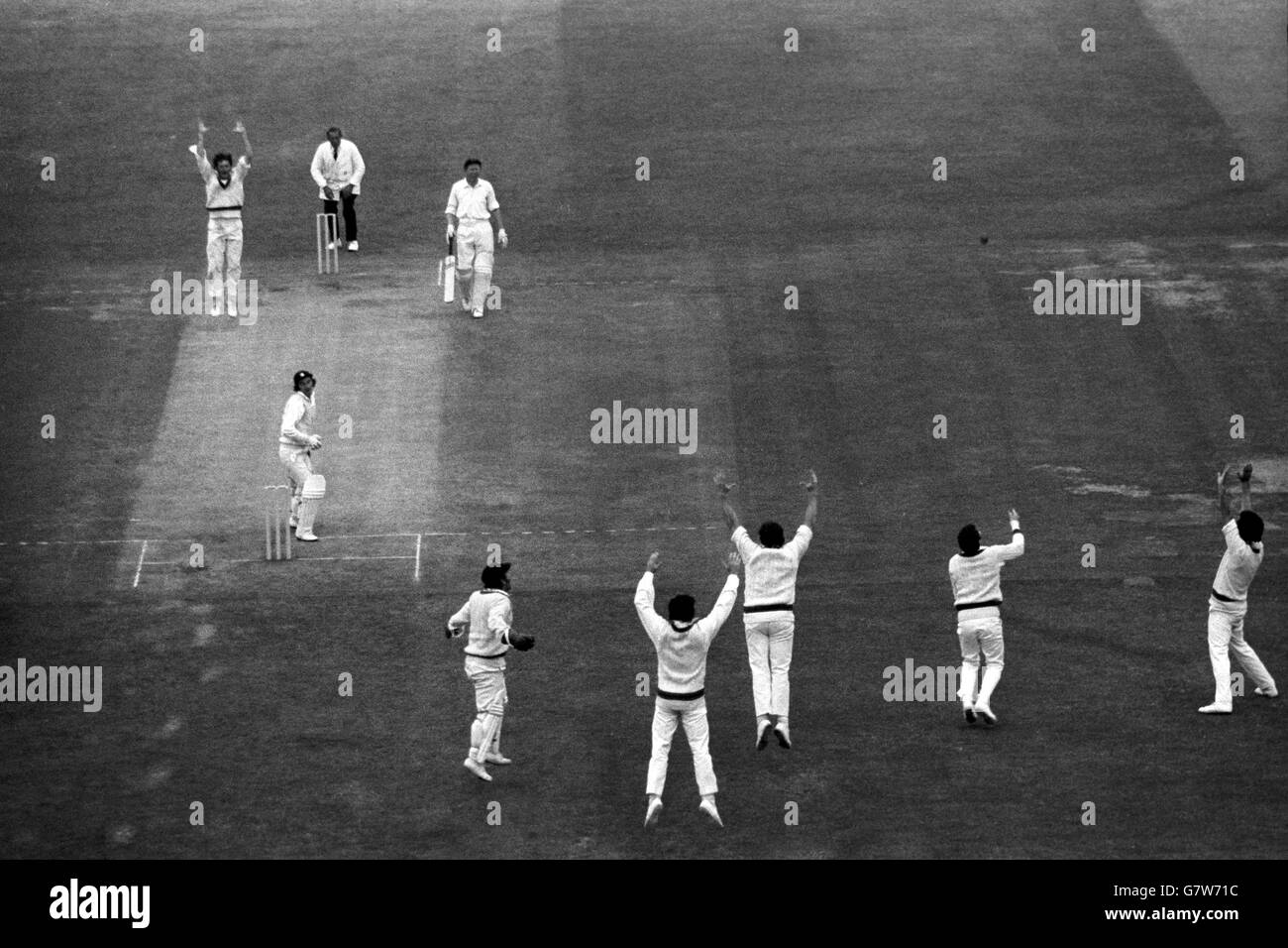 Alan Knott (batsman nearer camera) out for 12, caught by Greg Chappell off a ball from Bob Massie (top left), in England's disastrous second innings at Lord's. With Knott's wicket, his fourth in the innings, Massie had equalled the record of wickets taken in a Test debut, with 12 for 107. Stock Photo