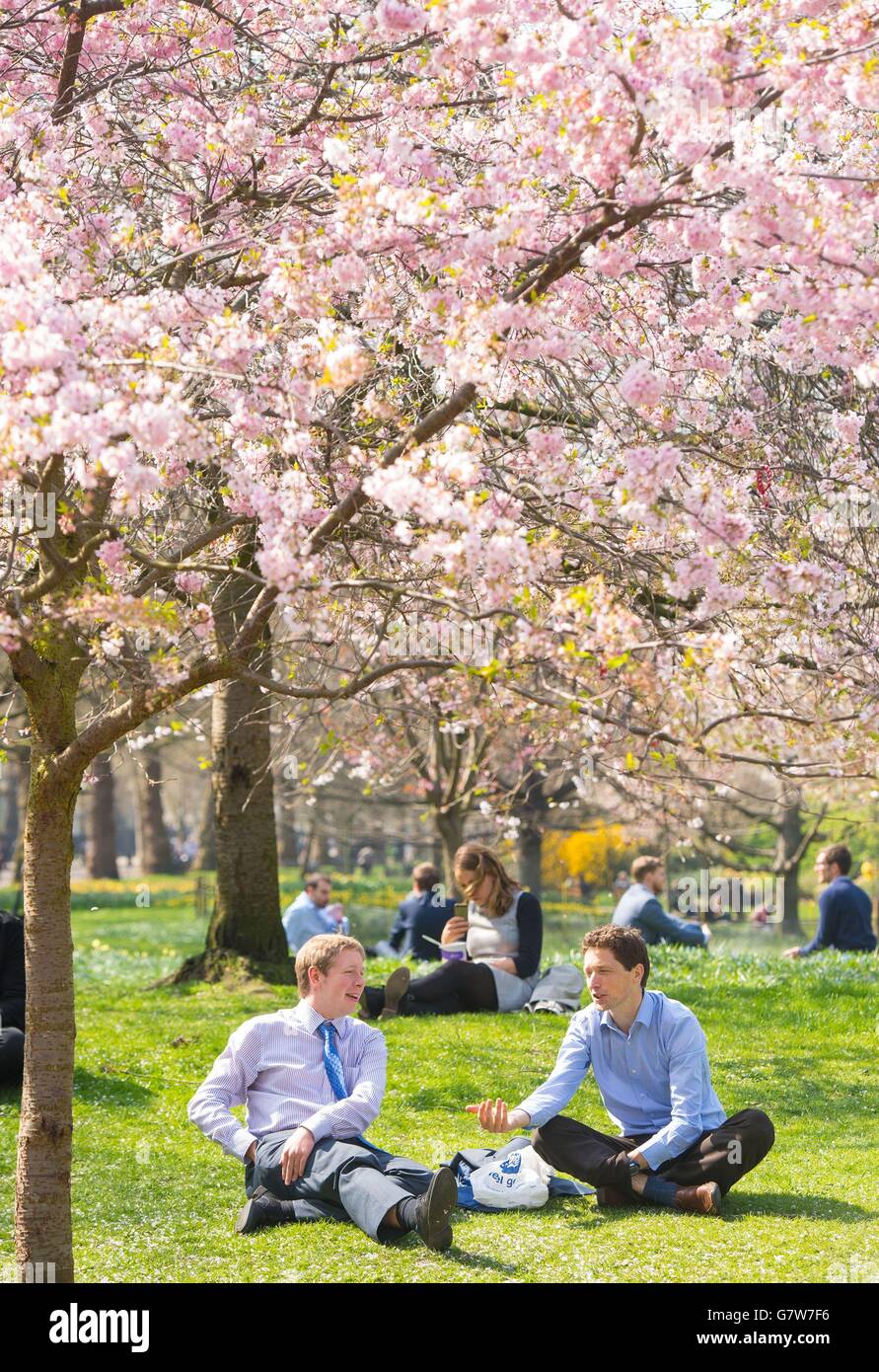 People enjoy the sun in St James Park, London, as warm weather continues across much of the UK. Stock Photo
