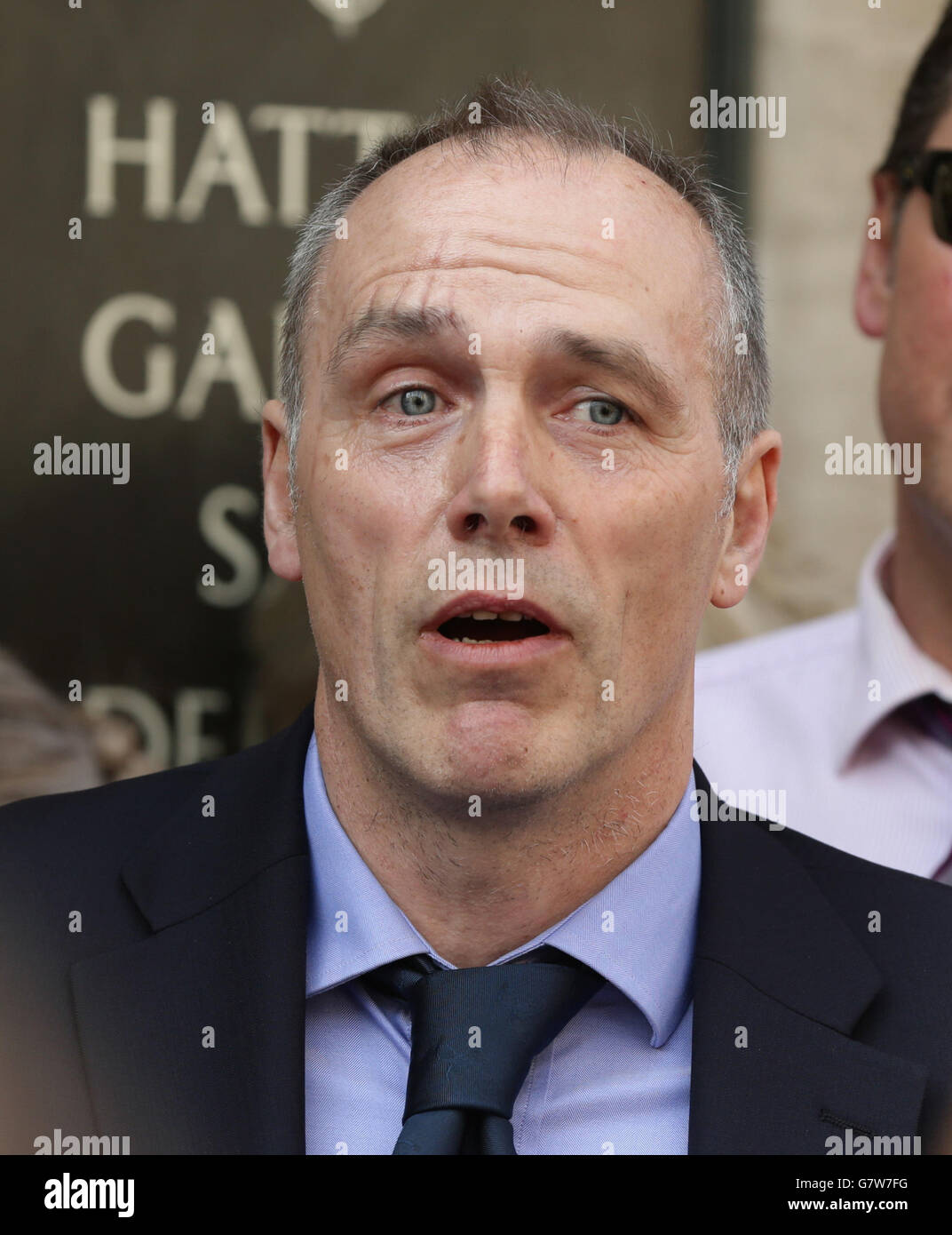 Scotland Yard Flying Squad Detective Chief Inspector Paul Johnson reads out a statement during a