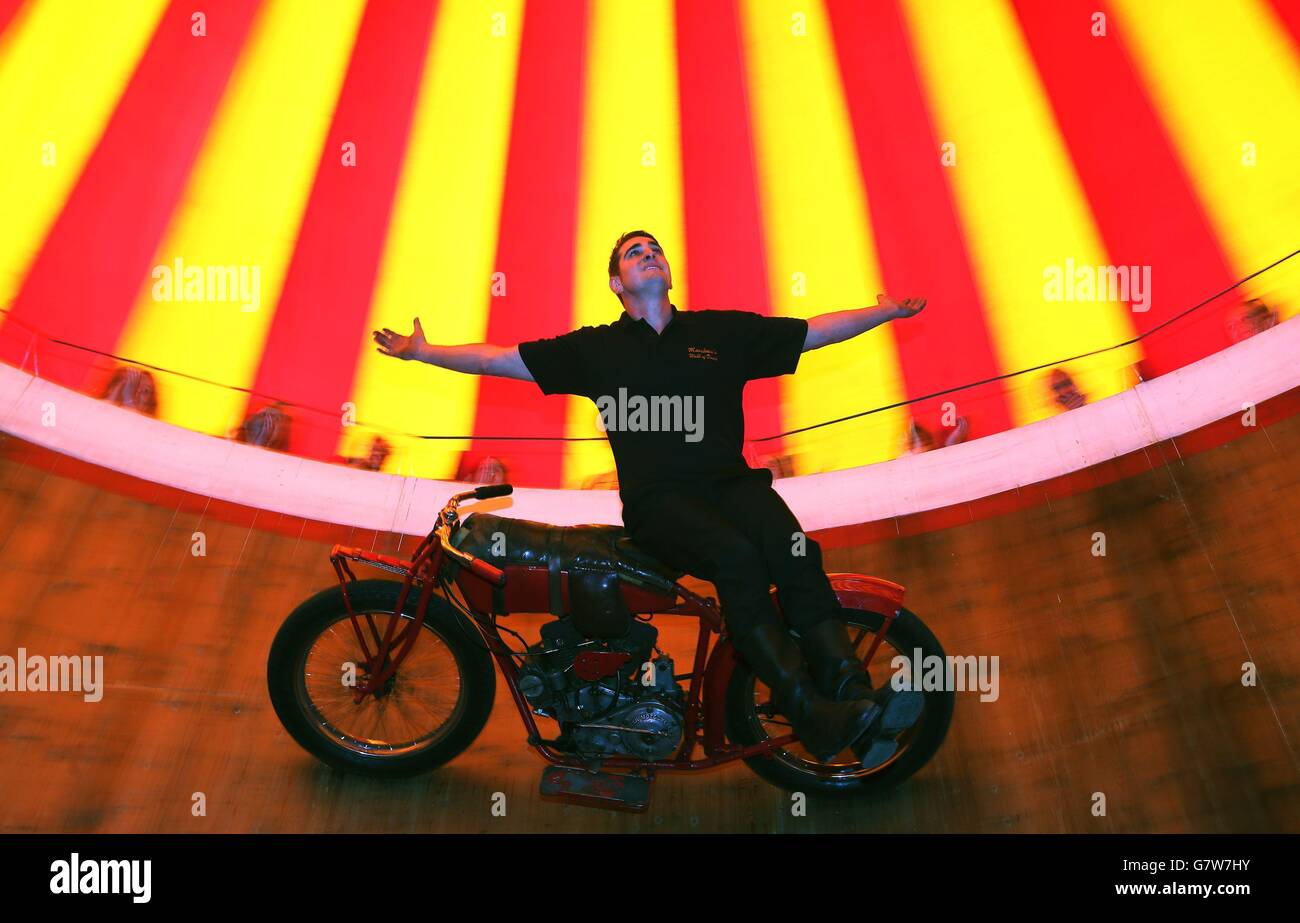 Jake Messham rides the Messham's Wall of Death at the Rua Red arts centre in Tallaght, Dublin, as part of the exhibition A Matter of Life and Death by Stephen Skrynka which celebrates Ireland's famed Wall of Death, as immortalised in the film Eat The Peach. Stock Photo