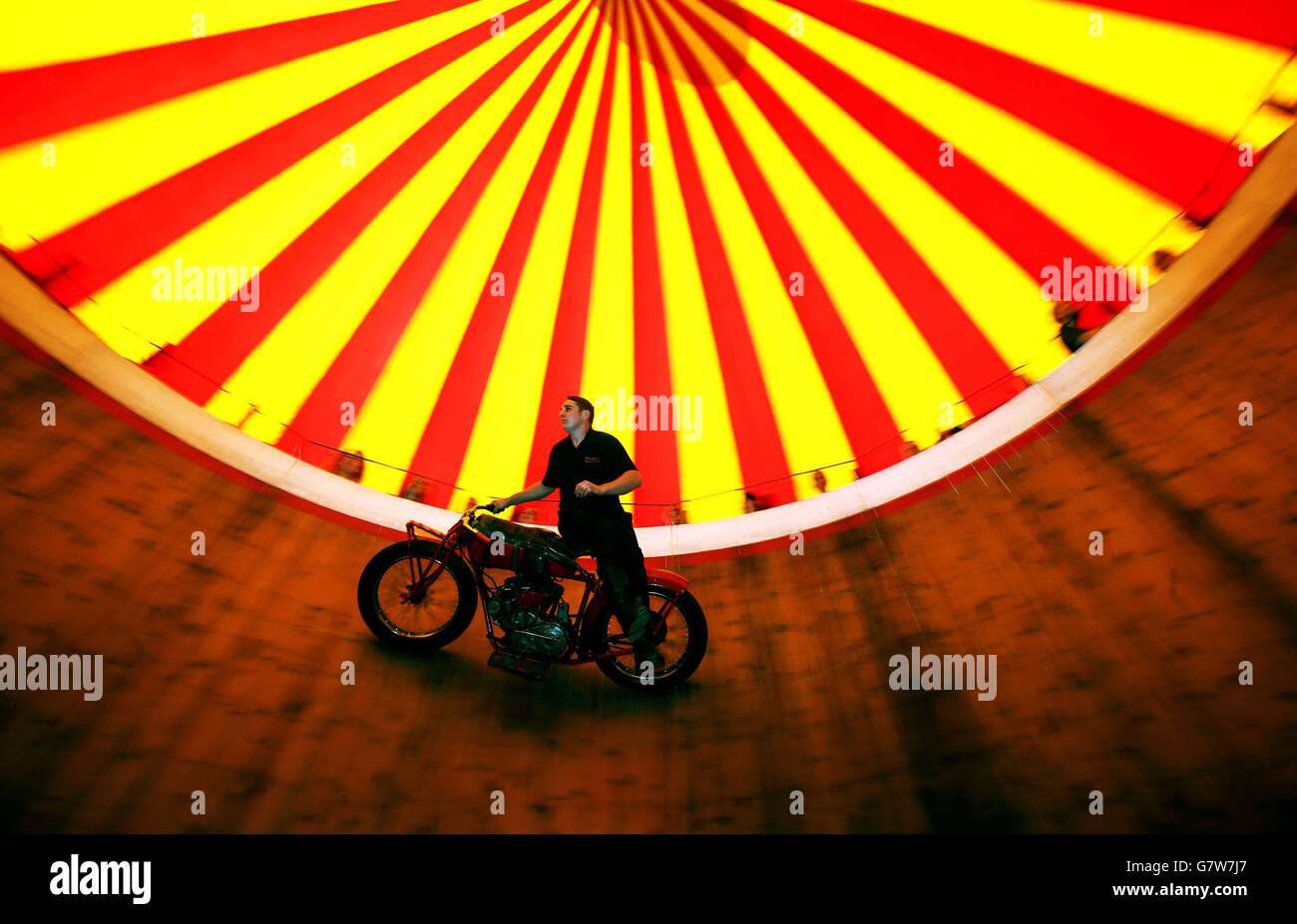 Jake Messham rides the Messham's Wall of Death at the Rua Red arts centre in Tallaght, Dublin, as part of the exhibition A Matter of Life and Death by Stephen Skrynka which celebrates Ireland's famed Wall of Death, as immortalised in the film Eat The Peach. Stock Photo