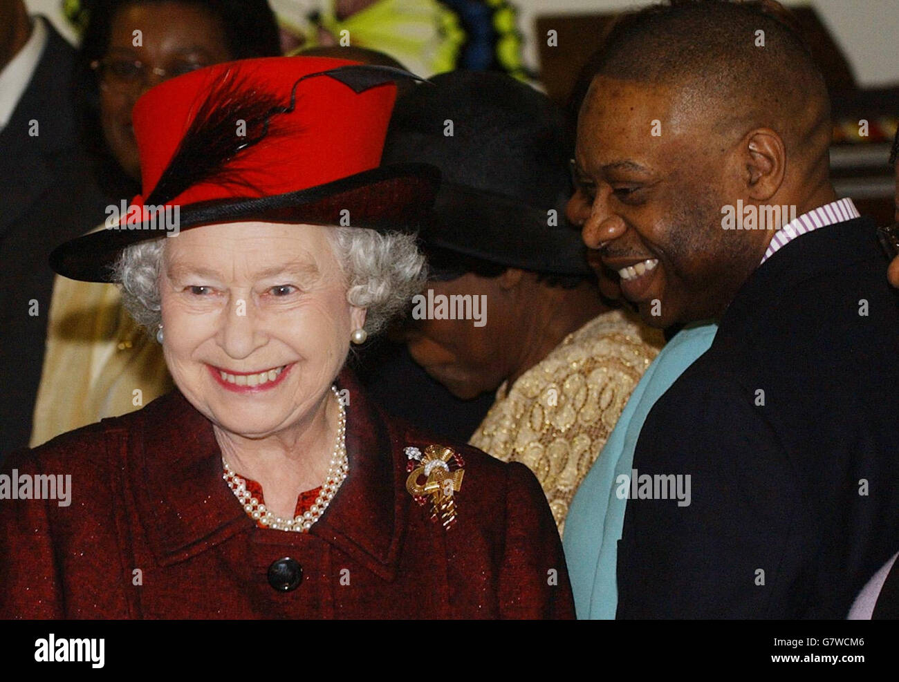 Britain's Queen Elizabeth II meets members of the 'New Testament Assembly Project', to see Caribbean handicrafts and cooking at the church and community centre. Stock Photo