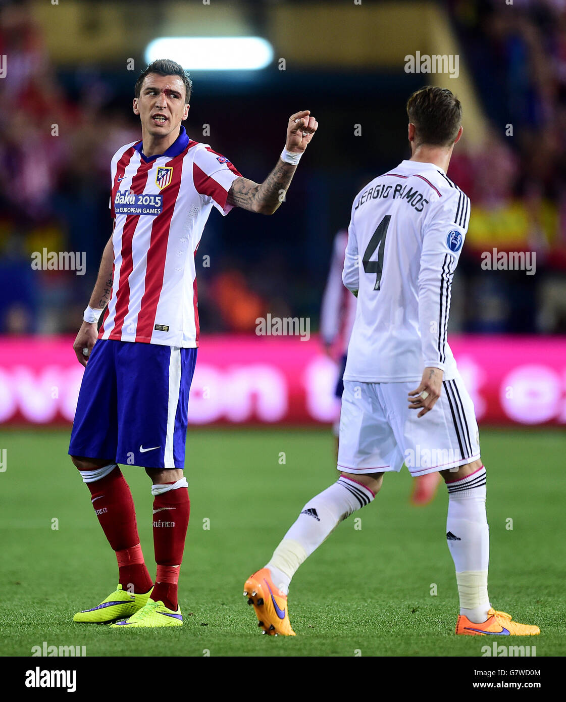 Atletico Madrid's Mario Mandzukic (left) argues with Real Madrid's Sergio Ramos Stock Photo