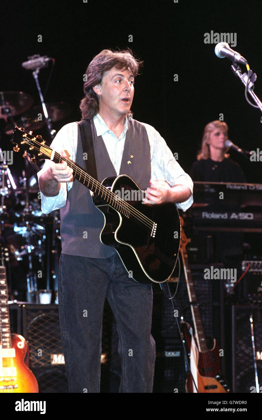 Ex-Beatle Sir Paul McCartney, wife Linda pictured in the background, rehearsing for his upcoming world tour at the Play House Theatre, London. Stock Photo