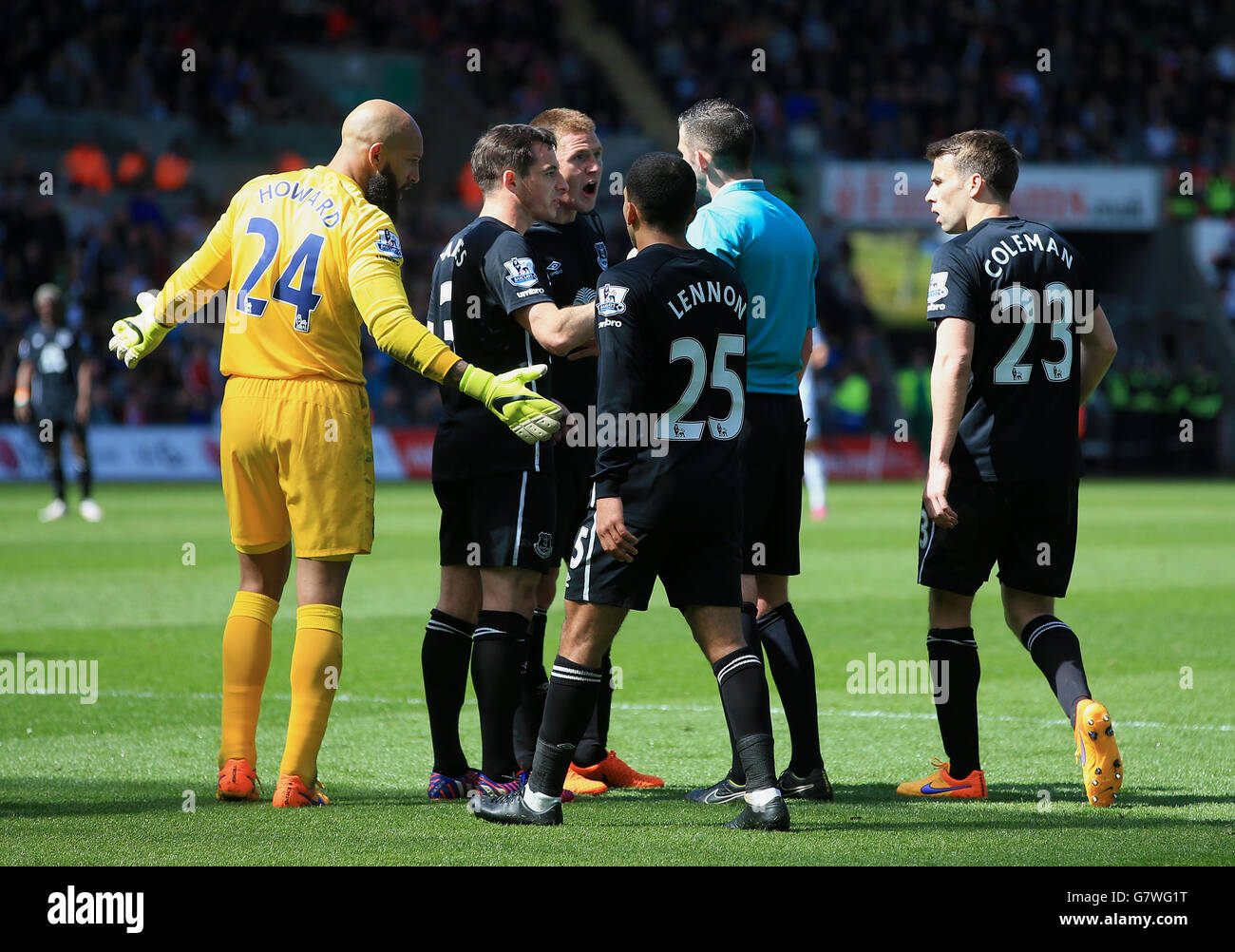 Everton players complain to referee Michael Oliver after he awarded Swansea City a penalty during the Barclays Premier League match at the Liberty Stadium, Swansea. Stock Photo