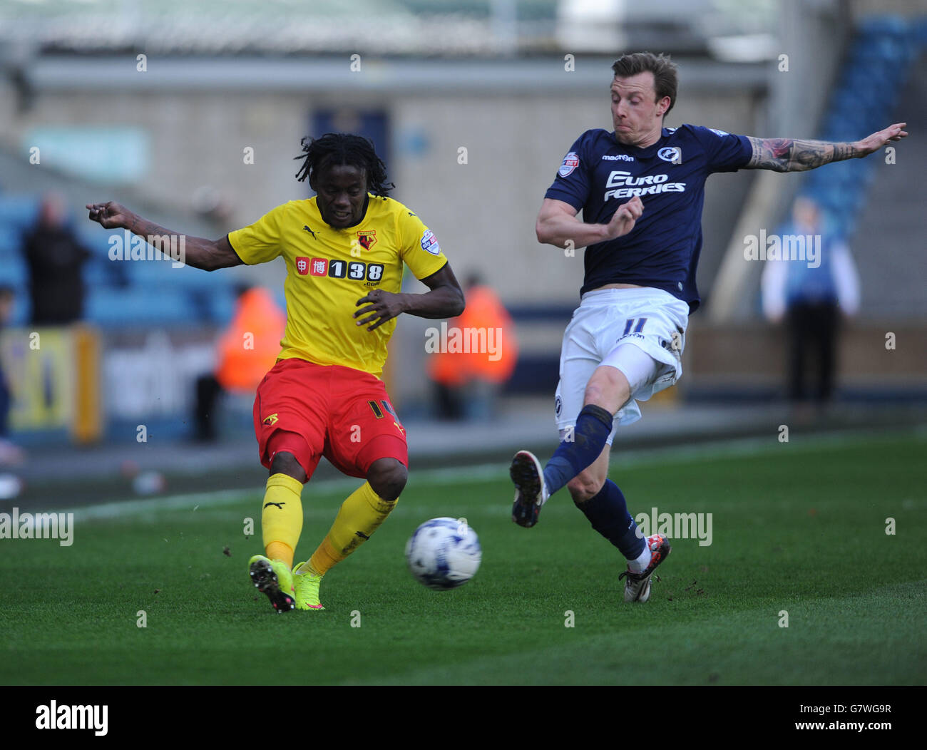 Watford's Juan Carlos Paredes (eft) and Millwall's Martyn Woolford during the Sky Bet Championship match at The New Den, London. Stock Photo