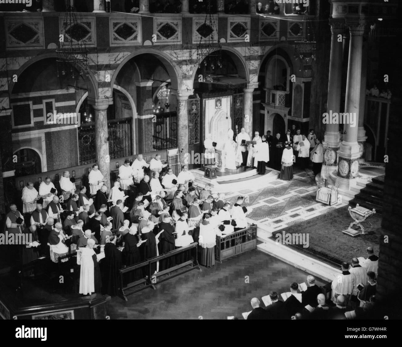 Dr William Godfrey was solemnly enthroned as seventh Roman Catholic Archbishop of Westminster in Westminster Cathedral, London, the Feast of the Apparition of Our Lady at Lourdes. Dr. Godfrey was born in Liverpool in 1889, was formerly Archbishop of Liverpool. He succeeds the late Cardinal Bernard Griffin. Stock Photo