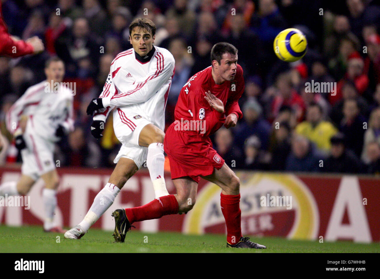 Soccer - UEFA Champions League - Round of 16 - First Leg - Liverpool v Bayer Leverkusen - Anfield. Liverpool's Jaime Carragher tries to stop Bayer Leverkusen's Dimitar Berbatov from taking a shot at goal Stock Photo