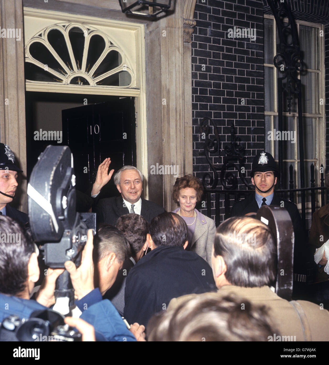 Harold Wilson waves to the crowd in Downing Street, accompanied by his wife Mary. He had arrives back from Liverpool already assured of a large majority in the new parliament. Stock Photo