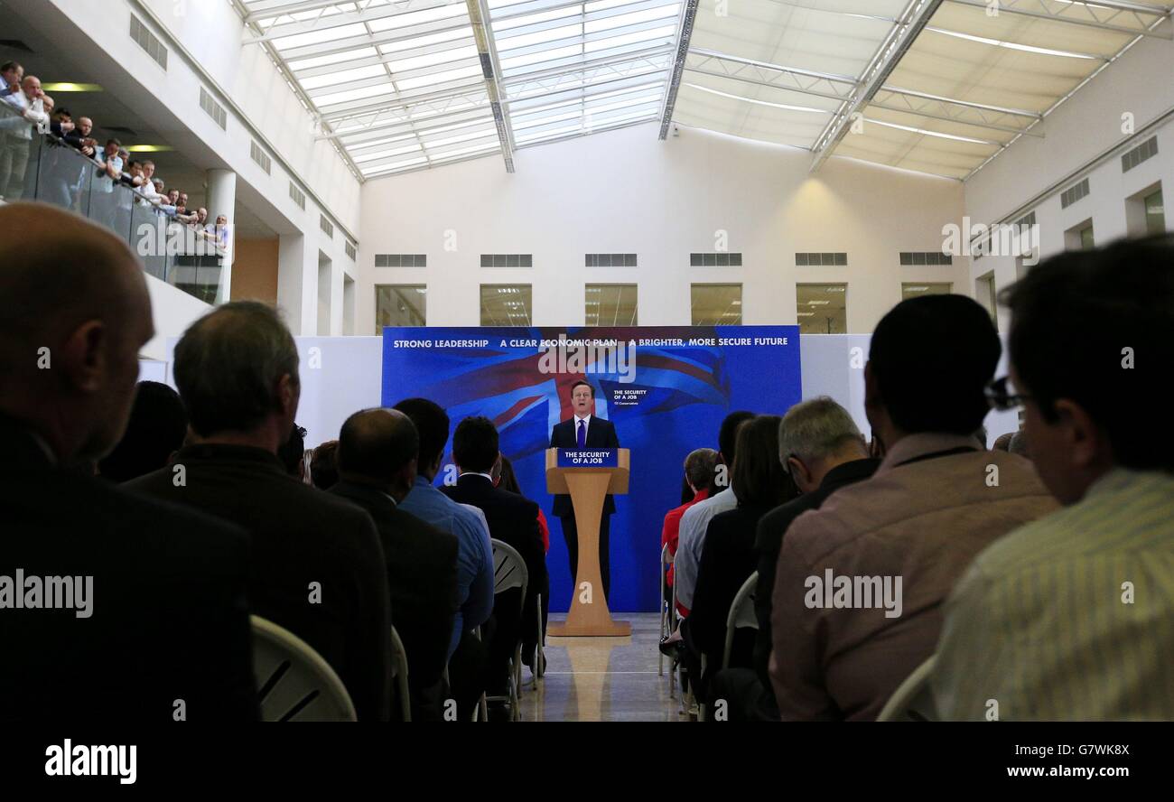 Prime Minister David Cameron delivers a speech at Fujitsu in Solihull, as Mr Cameron warned of more borrowing and taxes if Ed Miliband does a deal with the Scottish National Party to become Prime Minister. Stock Photo