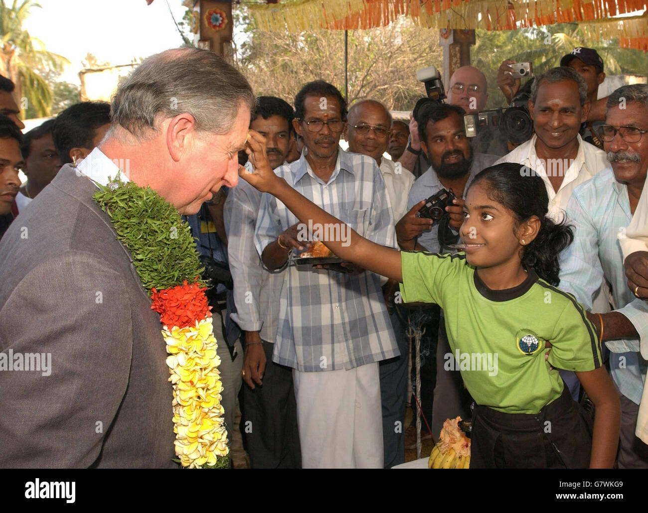 The Prince of Wales is marked with paint on his forehead as a sign of good luck, after he visited a Hindu temple in the village of Navallady which was devastated by the tsunami which hit the region. Stock Photo